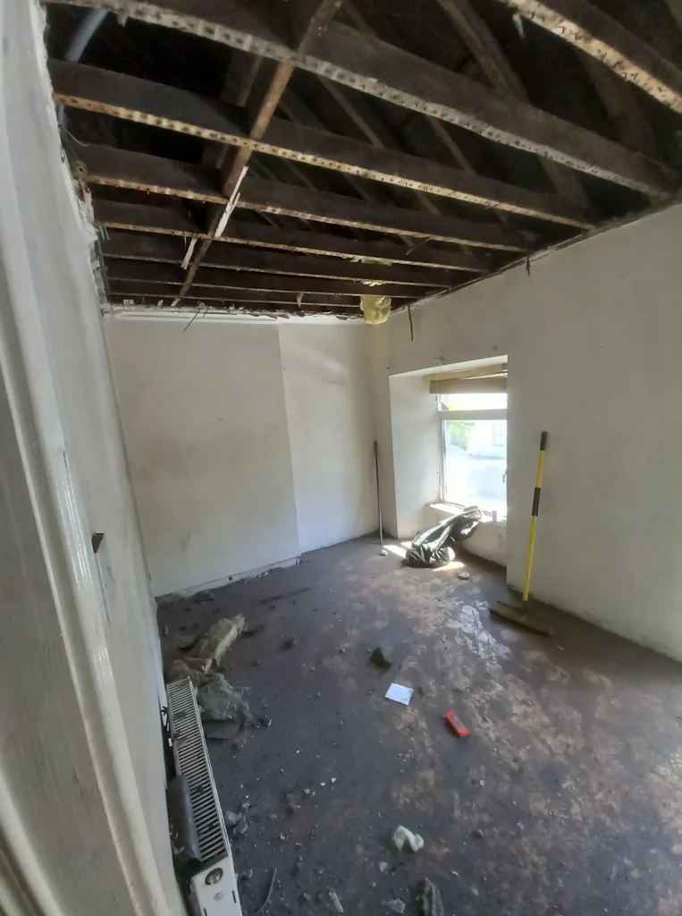 After plasterboard and insulation were pulled down at the kitchen.