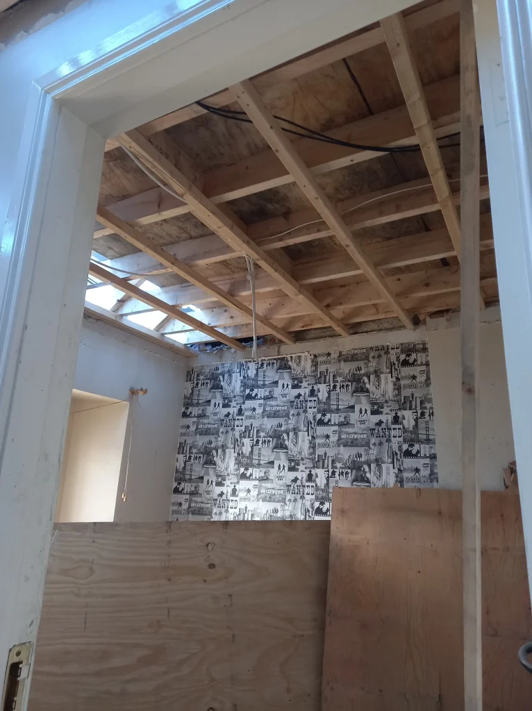 New ceiling joists with 2x2 counter batten in single bedroom.